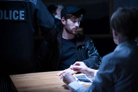 Suspicious man does not feel guilty and scaredの写真素材