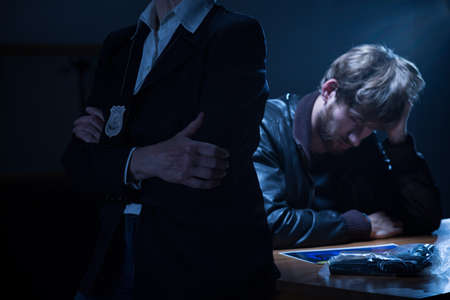 Police officer is waiting for a confession
