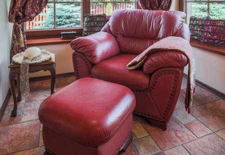 Red leather armchair in the living roomの写真素材