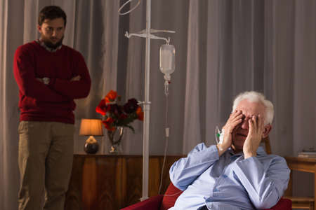 Photo of old man suffering from critical illnessの写真素材