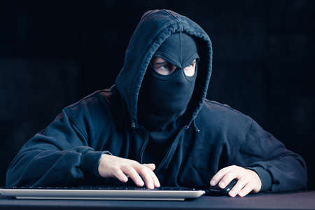 Image of masked dangerous cyber spy