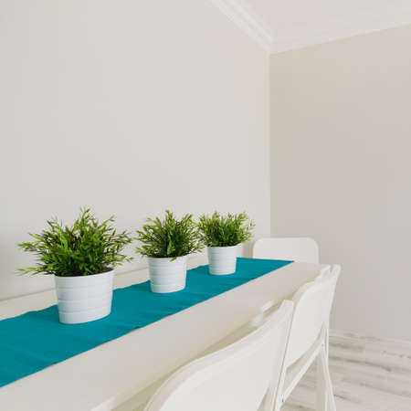 White flower pots on the dining tableの写真素材