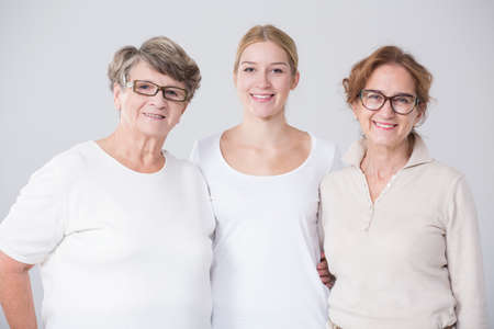 Photo of happy grandmother with daughter and grandchildの写真素材