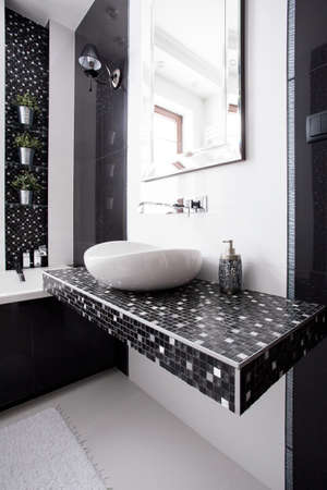 Black and white tiles in contemporary toiletの写真素材