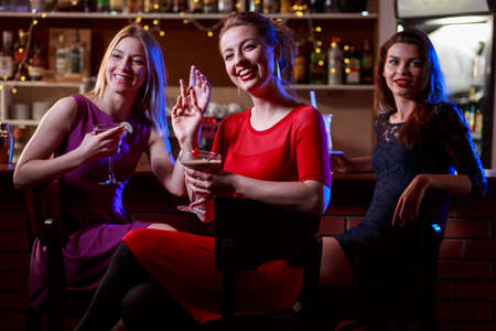 Pretty girls having an evening meeting in the clubの写真素材