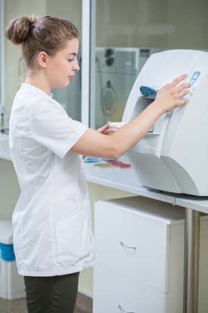 Female scientist is testing new machineの写真素材