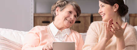 Older happy woman and new wireless technologyの写真素材