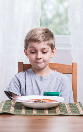 Photo of small picky eater during mealの写真素材