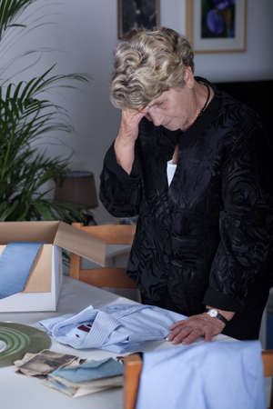 Picture of elderly gloomy female mourning her husband
