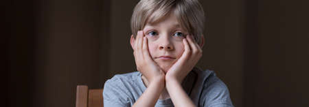 Panorama of sad lonely kid with social problem