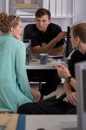 Photo of policemen working in the officeの写真素材