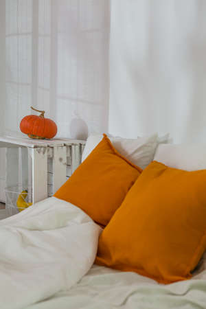 Handmade nightstand and mattress with white beddingの写真素材