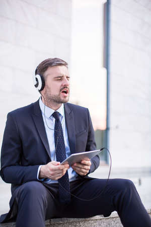 Picture of hard working businessman relaxing after workの写真素材