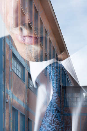 Close-up of man in suit in old building background