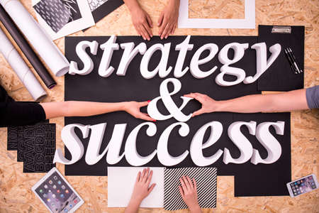 White strategy and success words on black backgroundの写真素材