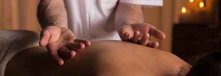 Panorama of professional soothing massage for back pain