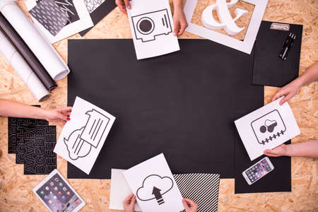 Colleagues working on new task by deskの写真素材