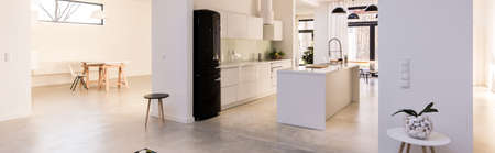 Panorama of contemporary design light kitchen with stylish furnitureの写真素材
