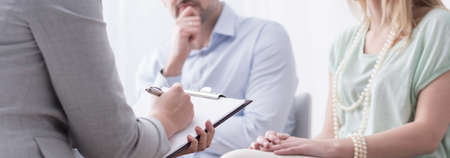 Panorama of psychologist helping married couple with problemの写真素材