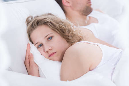 Young woman worried by problems in the relationshipの写真素材