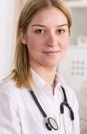 Portrait of young female doctor with stethoscopeの写真素材