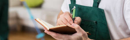 Professional cleaner is distributing duties among his workers