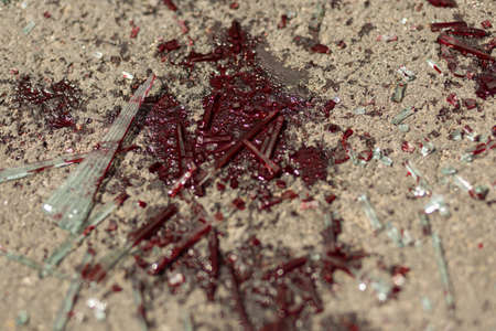 Glass from a car accident covered in bloodの写真素材