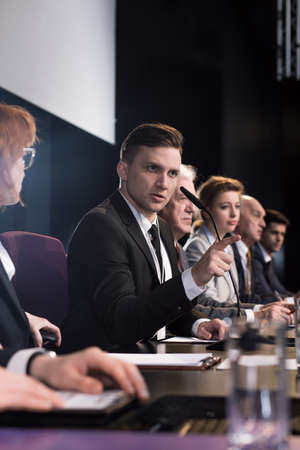 Young politician during his election campaign and his election team