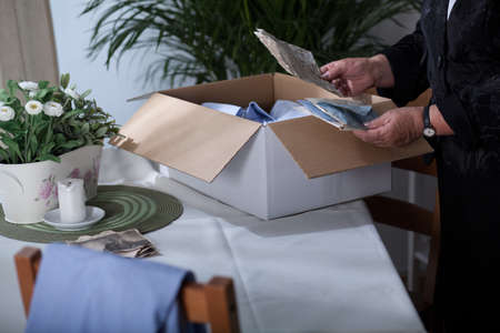 Old widow is saying goodbye to all her husband's things