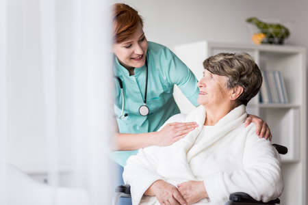 Image of disabled old patient during hospital treatment