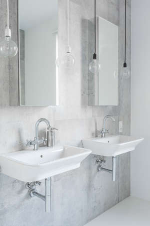 Contemporary decor of white bathroom with two sinksの写真素材