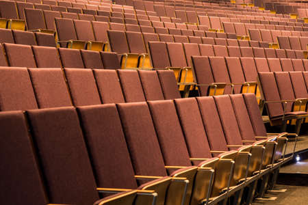 Shot of many rows of chairs in a lecture hallの写真素材