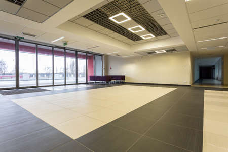 Shot of a spacious modern black and white hall