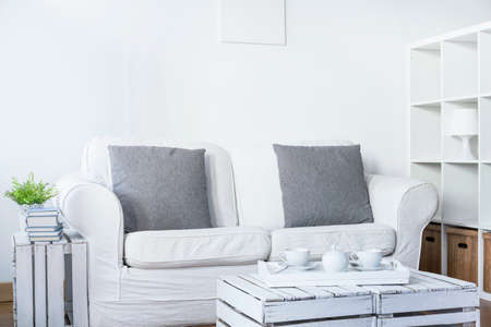 Light living room with sofa and handmade table