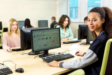Shot of a group of focused students in a computer room