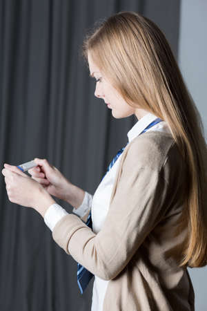 Teenage pretty girl and her positive pregnancy testの写真素材