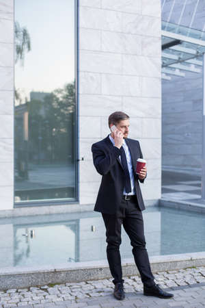 Hard working businessman and coffee breakの写真素材