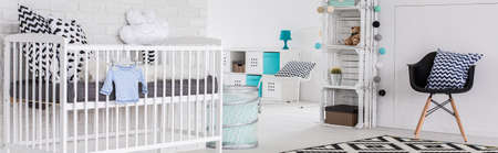 Spacious baby room with light furniture and simple decorations, panorama