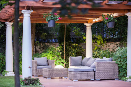 Wicker chairs and table on the terraceの写真素材