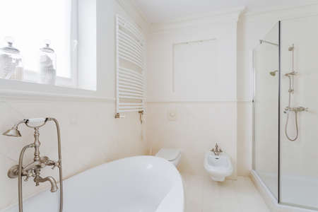 White sunny bathroom in modern expensive house