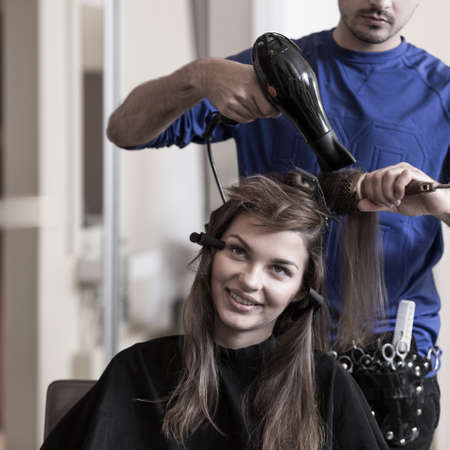 Image of brunette girl at hairdresser salonの写真素材