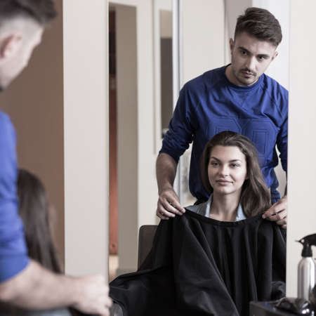 Attractive young brunette girl at the hairdresser'sの写真素材