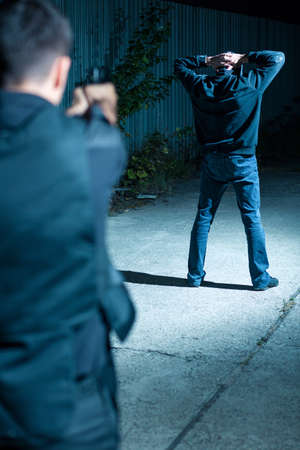 Armed special agent chasing after dangerous gangster