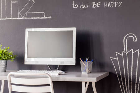 Picture of a computer in a modern study