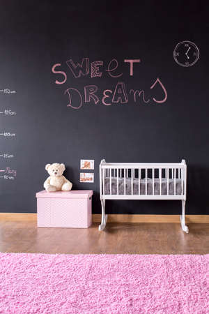 Shot of a modern baby room with a blackboard wallの写真素材