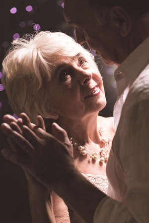 Shot of an elderly couple dancing and looking at each otherの写真素材