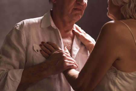 Shot of an elderly couple getting intimateの写真素材