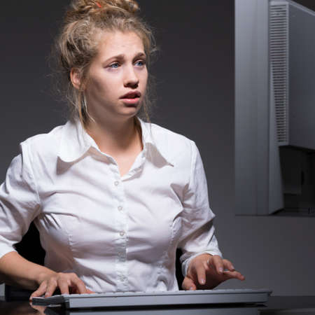 Female office worker having problem with computerの写真素材