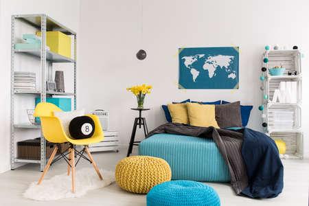 Shot of a modern yellow and blue bedroomの写真素材