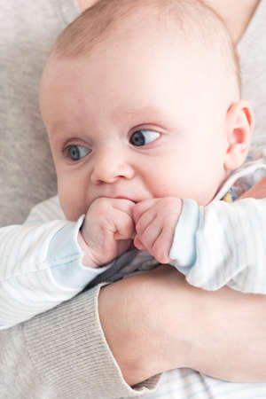 Cropped picture of a woman holding her babyの写真素材